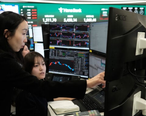 Asian shares mostly gain while oil prices keep rising