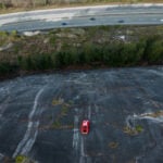 Car shell suspended on rock face above British Columbia highway in apparent prank