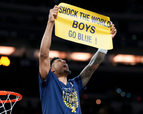 Michigan muscles its way to program's 2nd national title, beating stubborn UConn 69-63