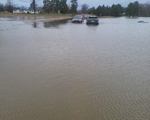 Flooding strands drivers and prompts more than a dozen rescues over the holiday weekend