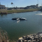 Woman, baby escape car that drove into pond