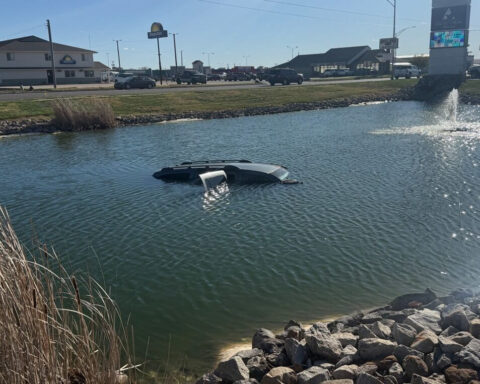 Woman, baby escape car that drove into pond