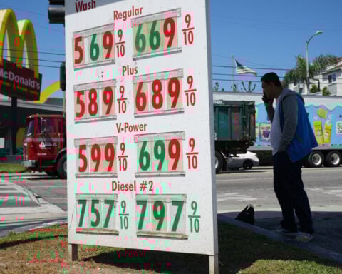 US economy grew a sluggish 0.5% in fourth quarter, government says, downgrading previous estimate