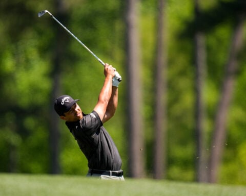 Xander Schauffele's shot lands in a viewer's merchandise bag. It didn't stop him from making par