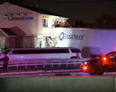 Tractor-trailer careens into building