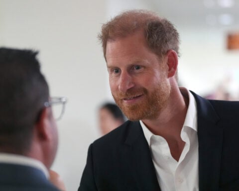 Prince Harry and Meghan arrive in Australia for a low-key, privately funded visit