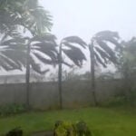 Flying tree limbs, collapsed buildings as major typhoon in Pacific bears down on remote US islands