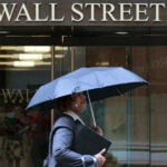Wall St banks show trading strength, caution on economic risk
