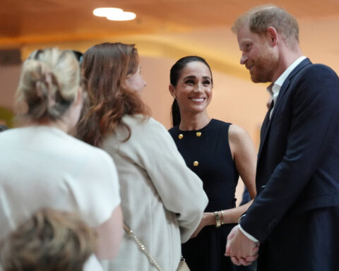 Prince Harry and Meghan arrive in Australia to a muted welcome