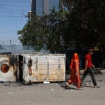 Police fire tear gas as workers' protest in India's Noida turns violent