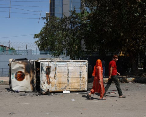 Police fire tear gas as workers' protest in India's Noida turns violent