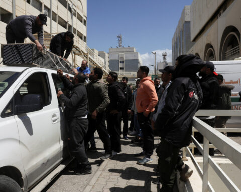 At Beirut hospital, grieving families identify mangled bodies after Israeli strikes