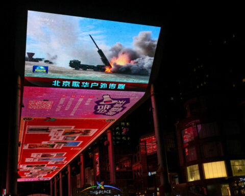 Taiwan sees only warships and warplanes as China talks peace with opposition