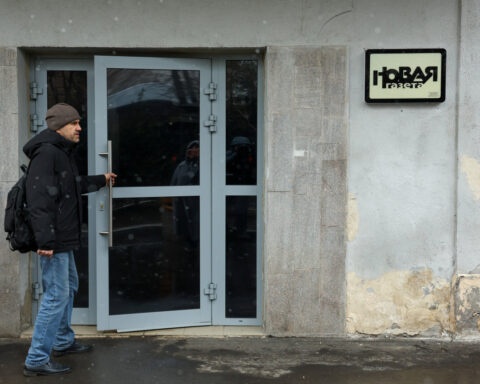 Masked security agents raid Russian newspaper in Moscow and arrest journalist