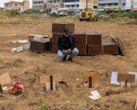 Lebanese man scours home bombed by Israel for mementos of his slain family