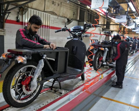 Soaring costs, fuel shortage fears drive Pakistan to electric motorbikes