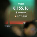 Asian stocks mostly higher after Wall Street hits record and oil steadies