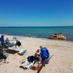 Russian grain ship believed sunk in Ukrainian drone attack is found and towed to shore, TASS says