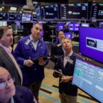 Wall Street ends mixed as worries linger before Good Friday break