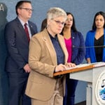 County prosecutor charges ICE agent with assault for pointing gun at people on Minneapolis highway