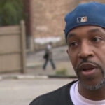 Man escapes waist-deep floodwater after rideshare gets stuck under bridge