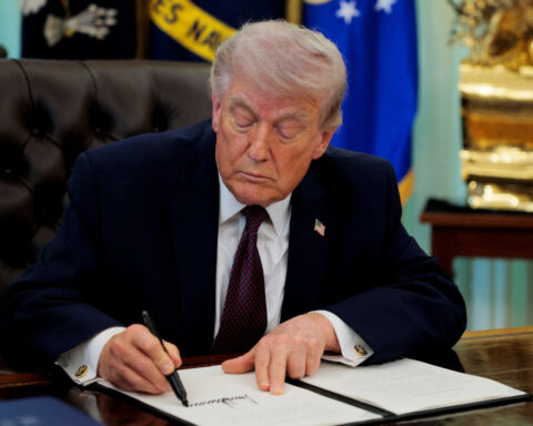 Trump signs order tightening mail-in voting, drawing swift legal threats