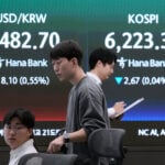Asian stocks lower and oil falls after Wall Street sets another record on ceasefire hopes