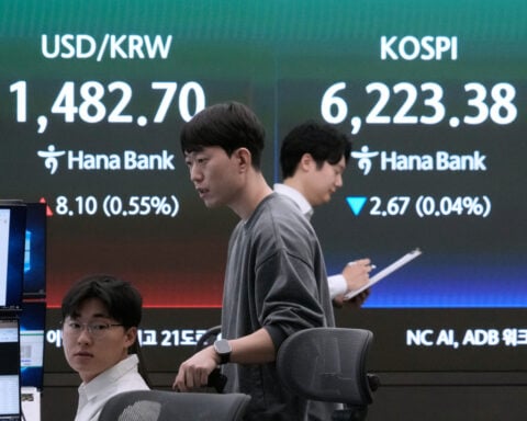 Asian stocks lower and oil falls after Wall Street sets another record on ceasefire hopes