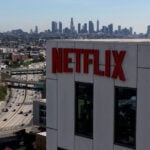 Netflix shares fall after downbeat revenue forecast, co-founder to leave