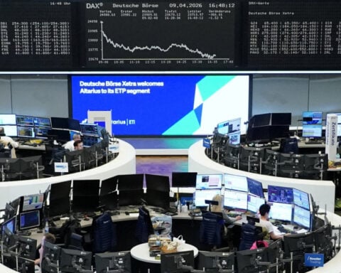 World stocks hold near record highs, oil keeps below $100 on peace deal hopes