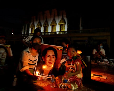 Myanmar cuts ex-leader Aung San Suu Kyi's sentence, frees former president