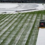 Surprise mid-April snow coats Coors Field as Dodgers-Rockies series gets off to frosty start