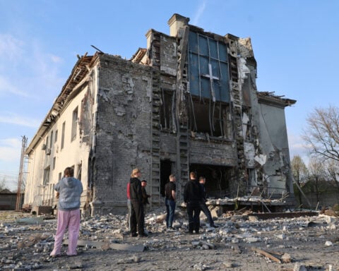 Russian attacks kill at least 2 as Ukraine strikes a Russian drone factory