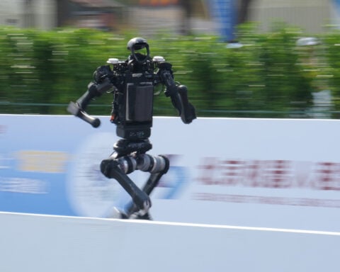 A humanoid robot sprints past the human half-marathon world record in Beijing race