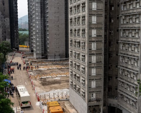 Grieving, traumatized survivors return to their homes 5 months after deadly Hong Kong fire