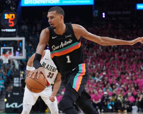 Wembanyama revels in safety of Hall of Famers, fans in playoff debut as Spurs top Blazers