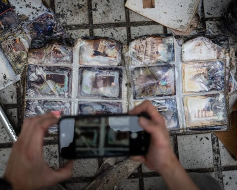 Grieving, traumatized survivors return to their homes 5 months after deadly Hong Kong fire