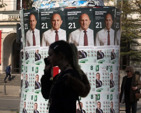 Tired of political turmoil, Bulgarians give ex-president a convincing mandate for change