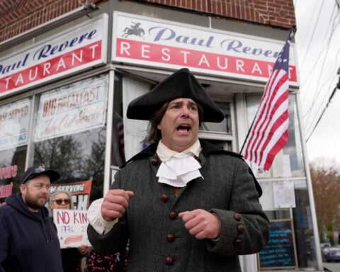 Paul Revere’s midnight ride unfolds in broad daylight — with a police escort