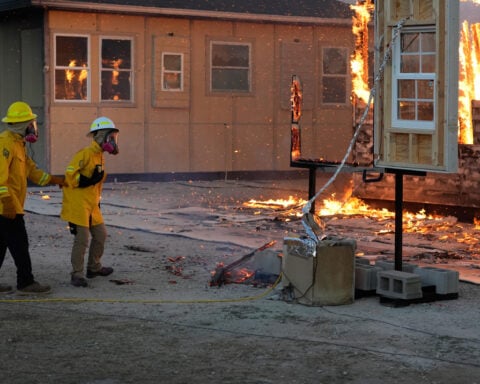 As the planet warms, scientists burn homes to figure out how to best protect them in wildfires