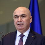 Romanian PM says he'll lead minority government after leftist Social Democrats walk out