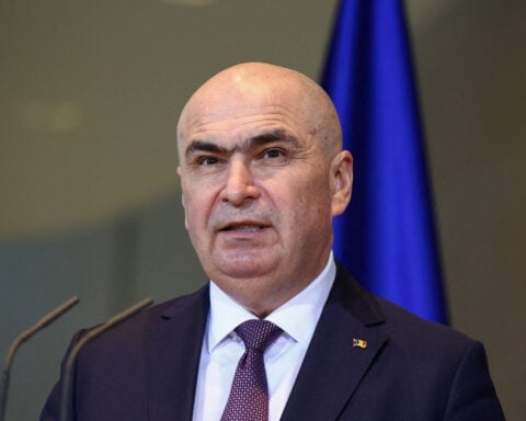 Romanian PM says he'll lead minority government after leftist Social Democrats walk out