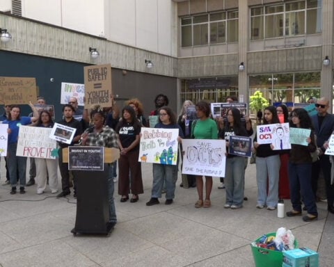 Community members rally against proposed budget cuts to arts and libraries
