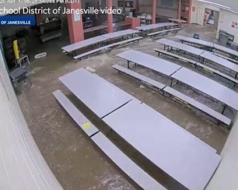 Water rushes into elementary school amid severe storm flooding