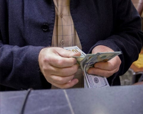 US halts Iraq dollar cash shipment after militia strikes, sources say