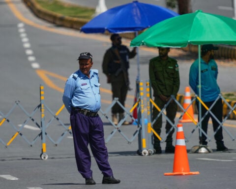 Iran fires on 3 ships in the Strait of Hormuz, complicating efforts to resume US-Iran talks