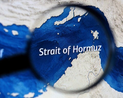 Three vessels hit by gunfire in Strait of Hormuz, crews safe