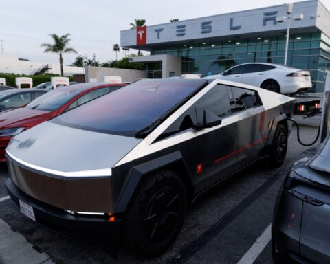 Tesla surprises with cash surplus, buying time for Musk's big bets