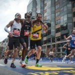 Runners were struggling to finish Boston Marathon when competitors came along and helped them across