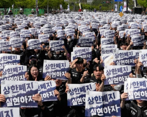 Samsung workers rally in South Korea, demanding higher pay and threatening to strike